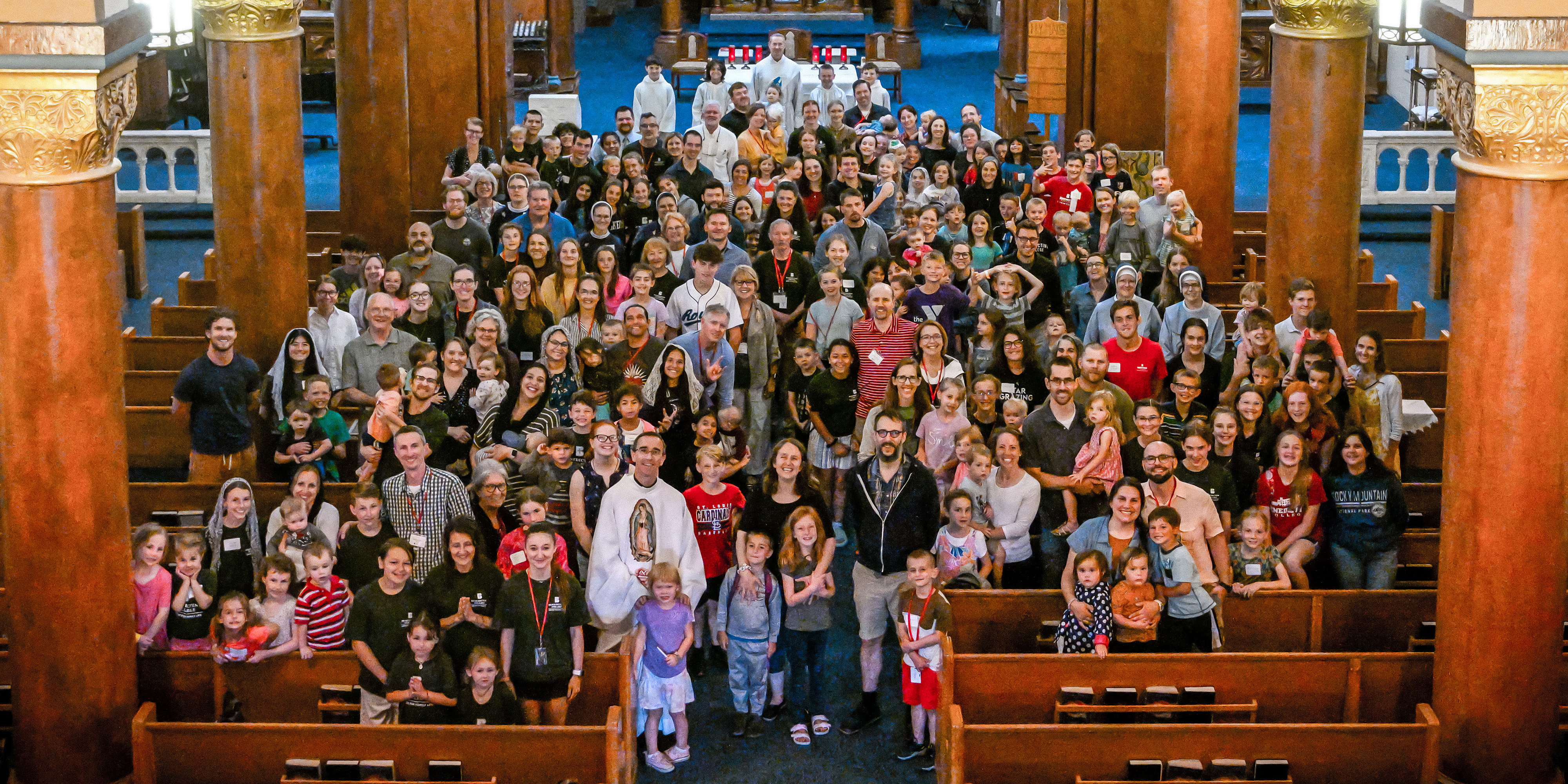 Attendees pose for a photo during Family Week
