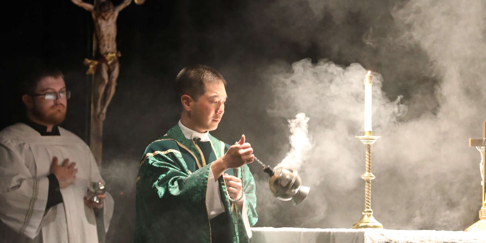 A priest elevates the Monstrance during Eucharistic Adoration