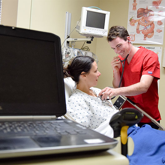 Nursing student smiling while at a clinical